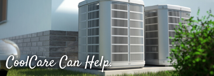 Two air conditioning units outside a house