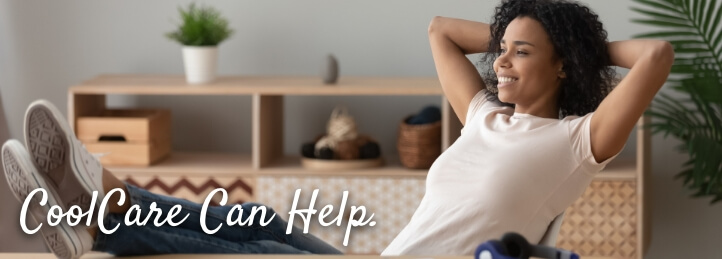 Woman sitting on a couch inside