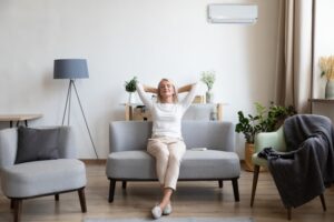 woman-leaning-back-on-couch-looking-comfortable