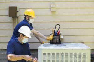 technicians-repairing-outdoor-AC-unit