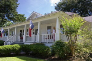 Texas-home-with-state-flags-on-porch