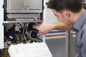 HVAC-technician-performing-heating-maintenance